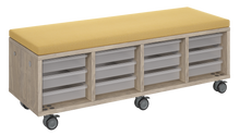 Load image into Gallery viewer, Mobile storage unit with four tray columns, optional upholstered seat for seating, customizable laminate finishes, and casters for easy mobility.