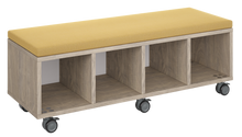 Load image into Gallery viewer, Mobile storage unit with four cubby columns, optional upholstered seat for seating, customizable laminate finishes, and casters for easy mobility.