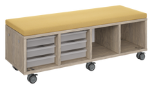 Load image into Gallery viewer, Mobile storage unit with a four column, tray and cubby configuration, optional upholstered seat for seating, customizable laminate finishes, and casters for easy mobility.