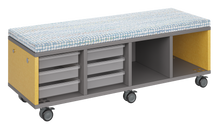Load image into Gallery viewer, Mobile storage unit with a four column, tray and cubby configuration, optional upholstered seat for seating, customizable laminate finishes, and casters for easy mobility.
