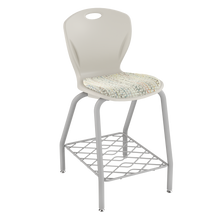 Load image into Gallery viewer, Discover four-leg stool with upholstered seat pad and bookrack for classrooms, cafeterias, and collaborative spaces.
